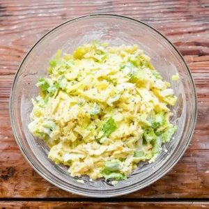 Shredded cabbage mixed with mayo and vinegar for hot honey chicken sandwich slaw.