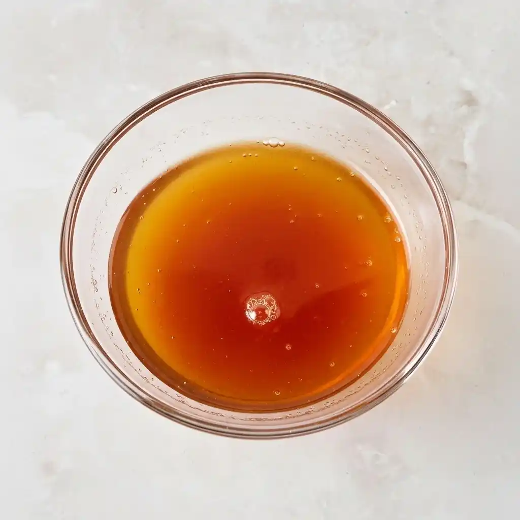 Homemade hot honey sauce in a small bowl