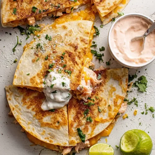 hot honey chicken quesadillas recipe with melted cheese and honey drizzle